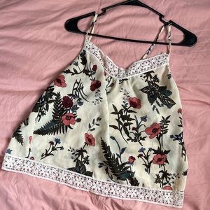 Pretty floral top by blush in size L , lightweight , see through , cream color.